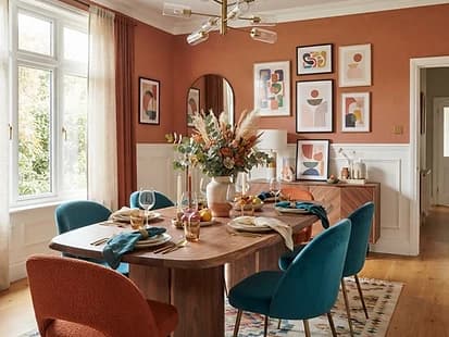 Painted terracotta accent wall in a dining room
